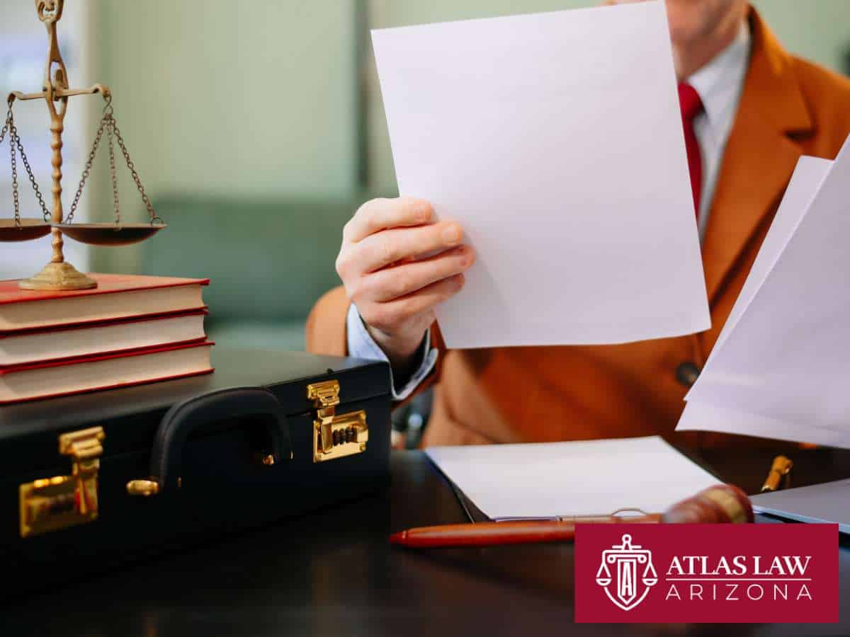 Attorney reviewing documents, showing how bankruptcy can help relieve flood-related debt in Arizona